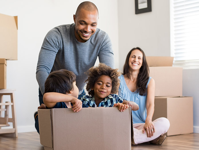 Family having fun with a cardboard box